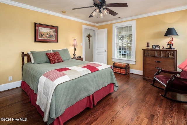 bedroom with ceiling fan, dark hardwood / wood-style floors, and crown molding