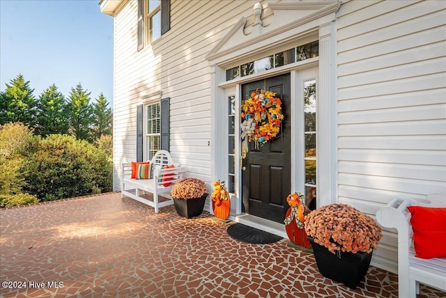 doorway to property featuring a patio