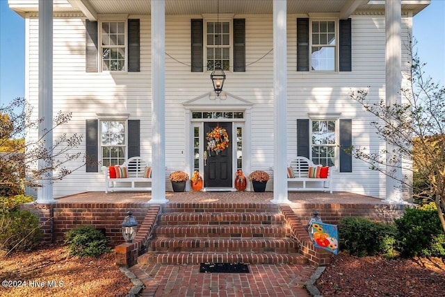 entrance to property with covered porch