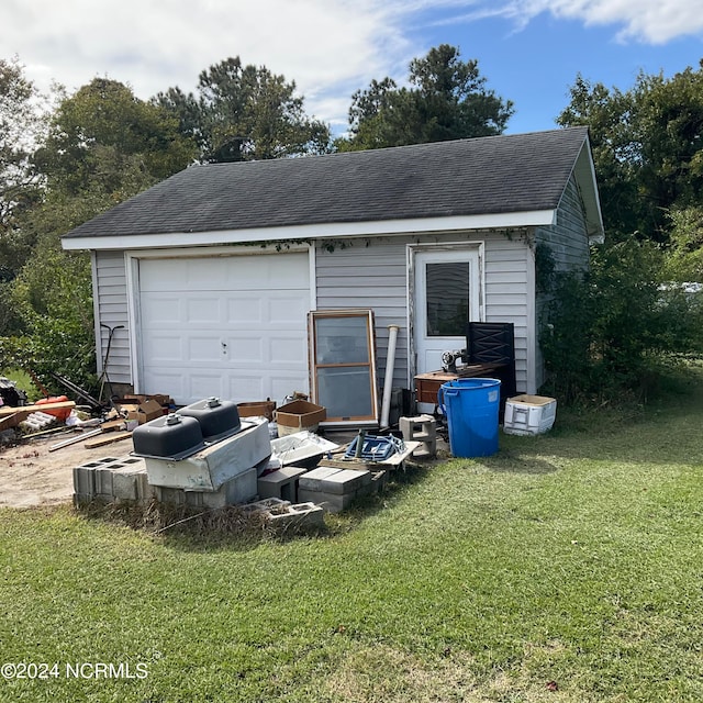 garage with a lawn