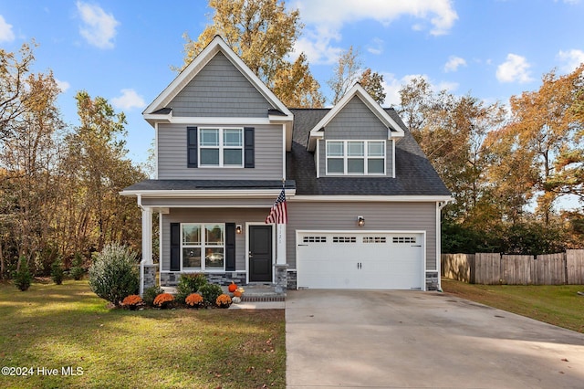 craftsman-style home with a garage and a front yard