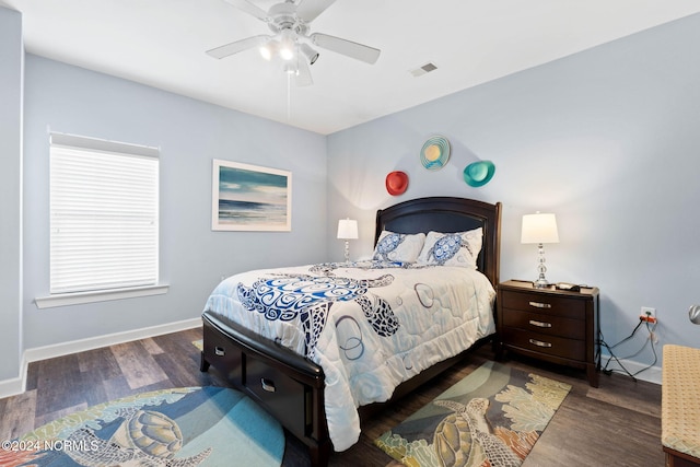 bedroom with dark wood-type flooring and ceiling fan