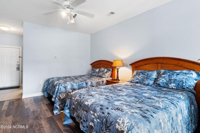 bedroom featuring ceiling fan and dark hardwood / wood-style flooring