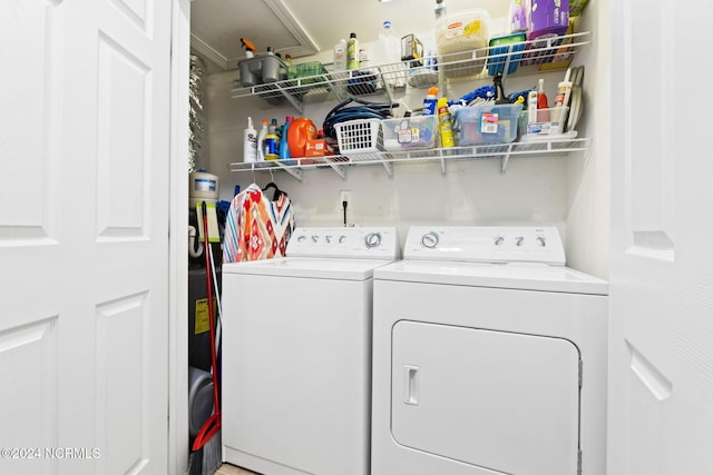 clothes washing area featuring washer and dryer