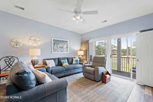 living room with wood-type flooring and ceiling fan