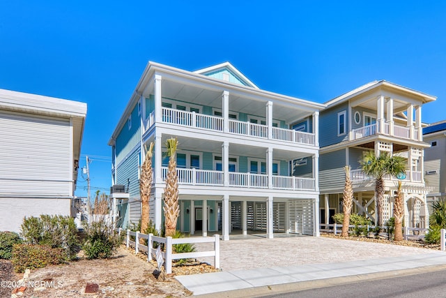 beach home featuring a balcony