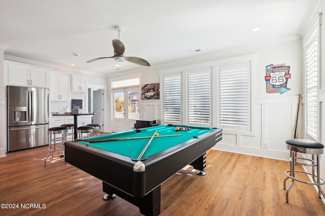 playroom featuring billiards, a ceiling fan, light wood-style flooring, wainscoting, and a decorative wall