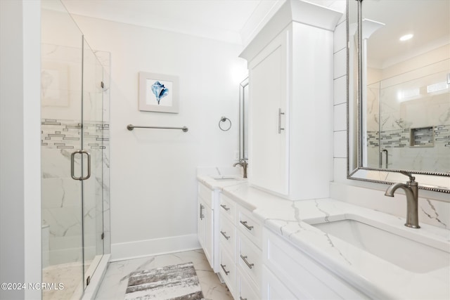 full bath featuring baseboards, marble finish floor, a marble finish shower, and a sink