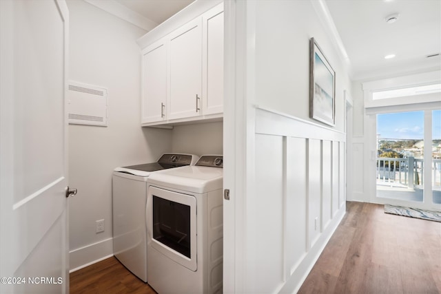 laundry area featuring washing machine and clothes dryer, baseboards, recessed lighting, wood finished floors, and cabinet space