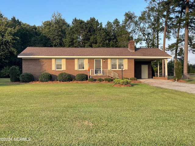 single story home with a carport and a front yard