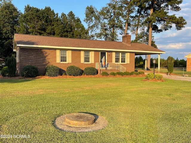 ranch-style house with a front yard