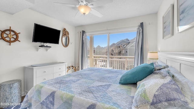 bedroom featuring access to outside, a ceiling fan, and a textured ceiling