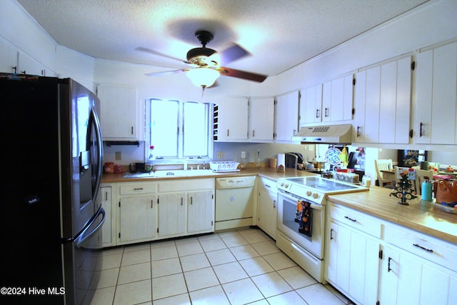 kitchen with ceiling fan, white cabinets, a textured ceiling, white appliances, and light tile patterned floors