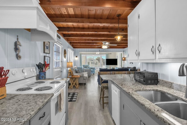 kitchen with beam ceiling, light hardwood / wood-style flooring, white appliances, and white cabinets