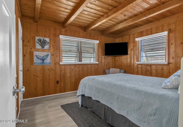 bedroom with wood ceiling, wood-type flooring, and wood walls