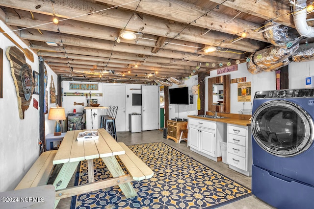 basement with washer / clothes dryer and sink