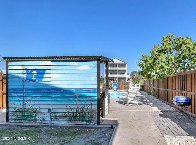 view of pool featuring a patio