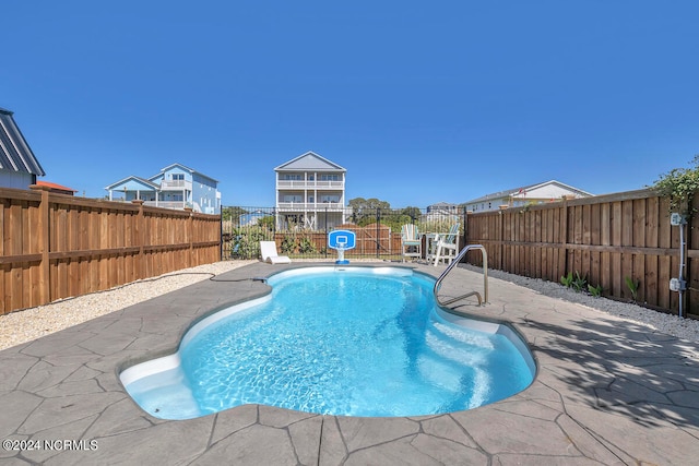 view of swimming pool featuring a patio area