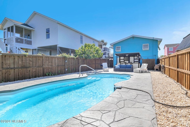 view of swimming pool featuring a patio area