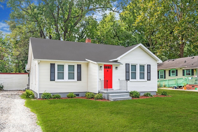 single story home featuring a front lawn, crawl space, and a chimney