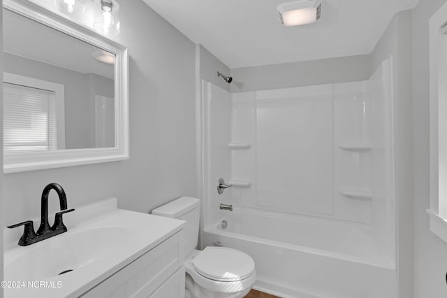 full bath with vanity, shower / tub combination, visible vents, and toilet