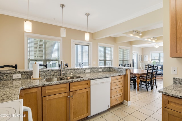 kitchen with beam ceiling, light tile patterned floors, light stone countertops, dishwasher, and sink