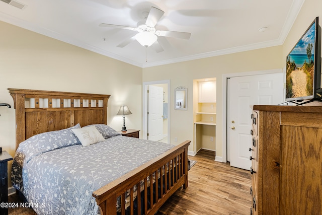 bedroom with ceiling fan, ornamental molding, and light hardwood / wood-style flooring