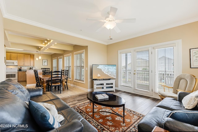 living room featuring light hardwood / wood-style floors, crown molding, beamed ceiling, and ceiling fan