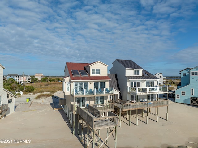 rear view of house featuring a balcony