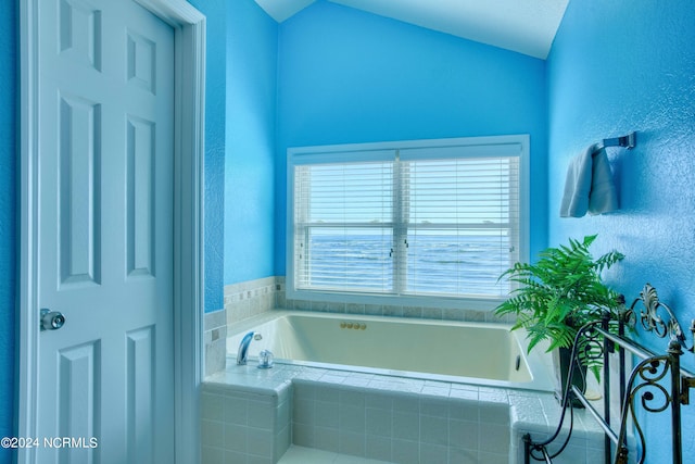 bathroom featuring a relaxing tiled tub