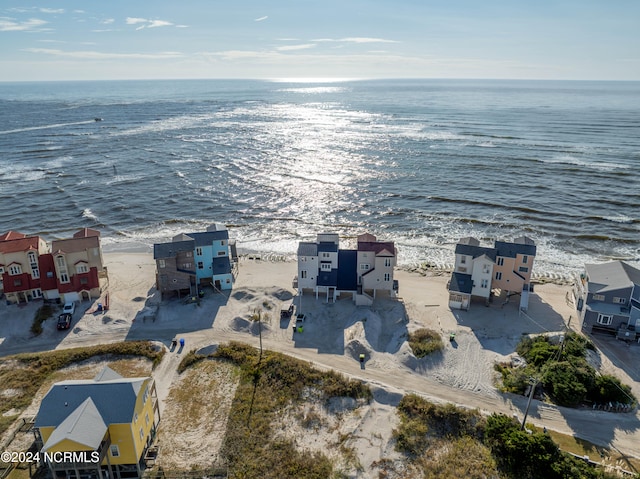 bird's eye view with a water view and a view of the beach