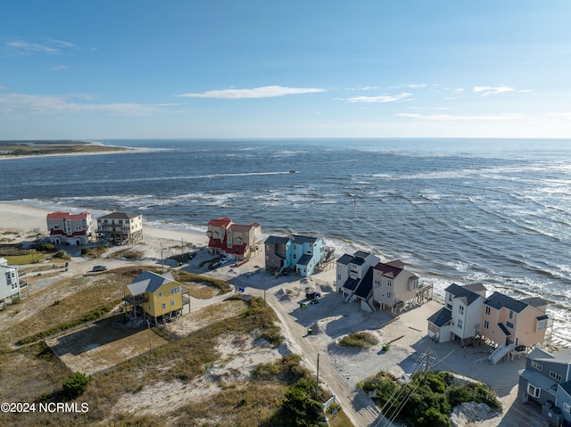 aerial view featuring a water view and a beach view