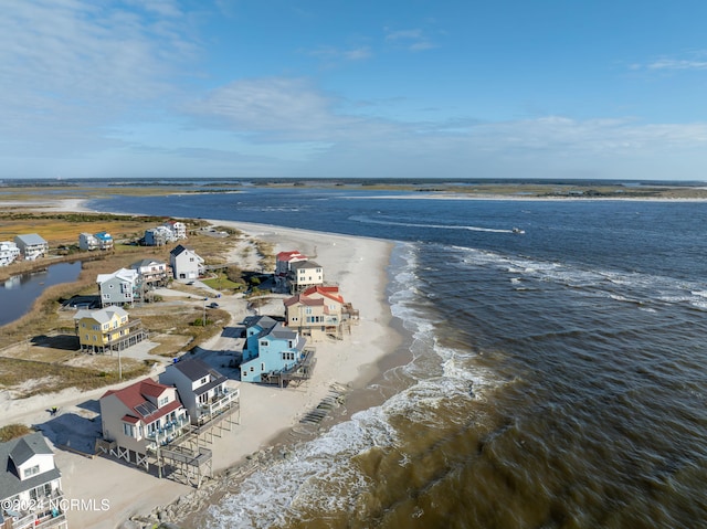 bird's eye view featuring a water view and a view of the beach