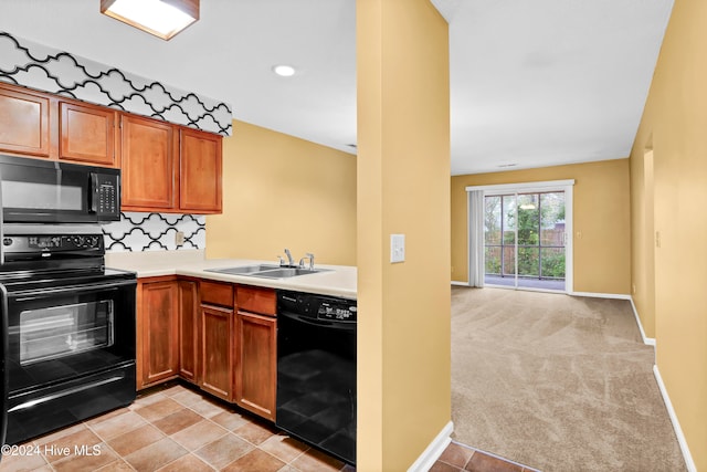 kitchen featuring decorative backsplash, black appliances, sink, and light carpet