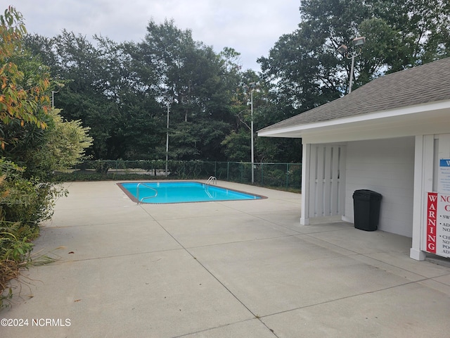 view of pool featuring a patio area