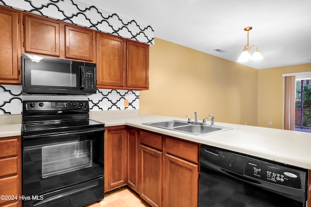 kitchen with sink, black appliances, decorative light fixtures, a notable chandelier, and decorative backsplash