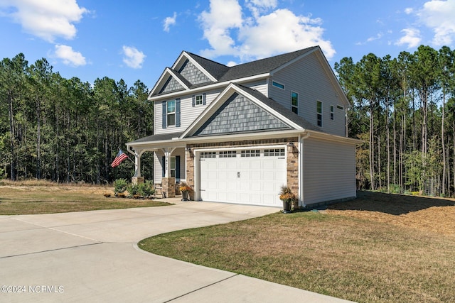 craftsman-style home featuring a front yard and a garage