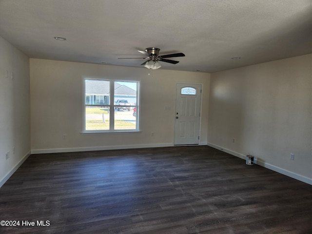 foyer featuring a textured ceiling, ceiling fan, and dark hardwood / wood-style floors