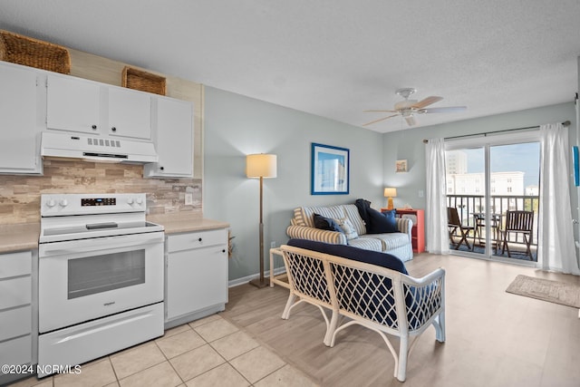 kitchen featuring ceiling fan, backsplash, white cabinets, electric stove, and a textured ceiling