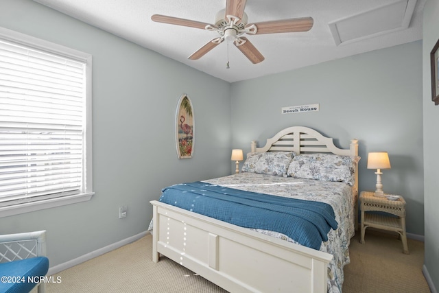 bedroom with light colored carpet and ceiling fan