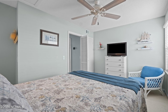 carpeted bedroom featuring ceiling fan