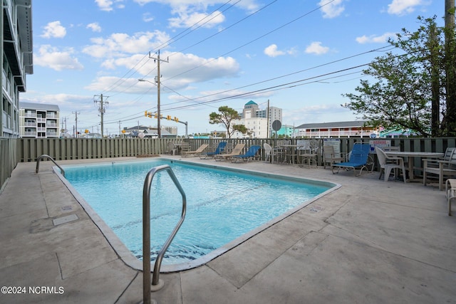 view of swimming pool with a patio area