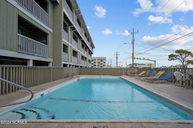 view of swimming pool with a patio area