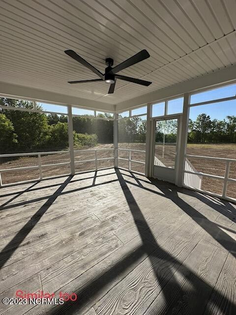 exterior space featuring ceiling fan