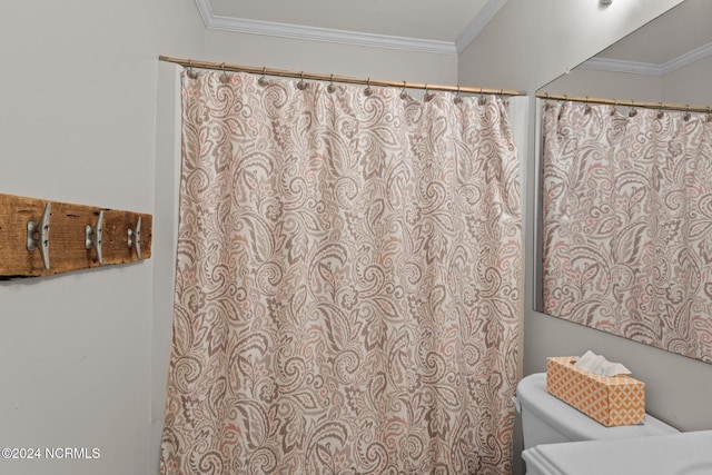 full bathroom featuring toilet and crown molding