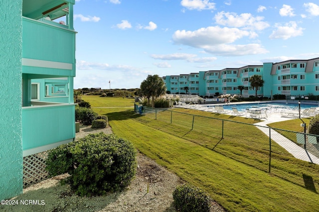 view of yard featuring a community pool