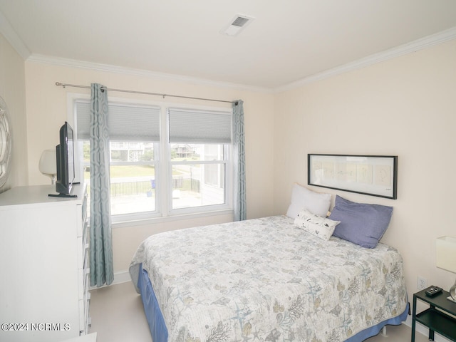 bedroom with ornamental molding