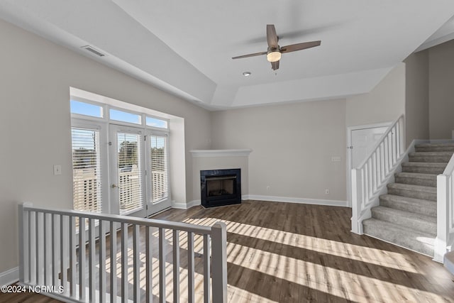 living room with hardwood / wood-style flooring and ceiling fan