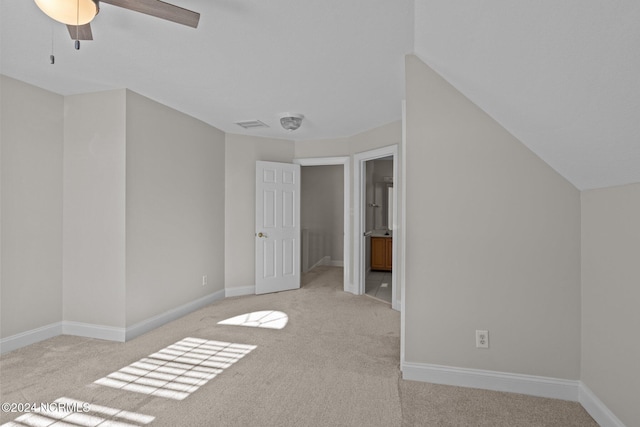 interior space with vaulted ceiling and ceiling fan