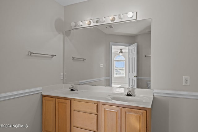 bathroom with ceiling fan, vanity, and toilet